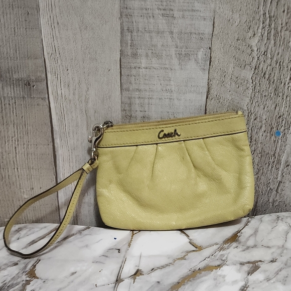 Coach Handbags - 🌷Coach Light Yellow Leather Wristlet🌷